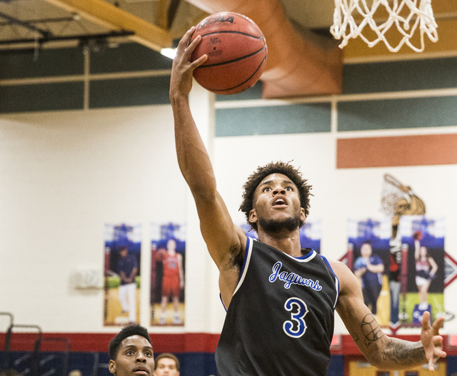 Desert Pines’ Trevon Abdullah-Booker (3) drives to the basket past Coronado’s Ta ...