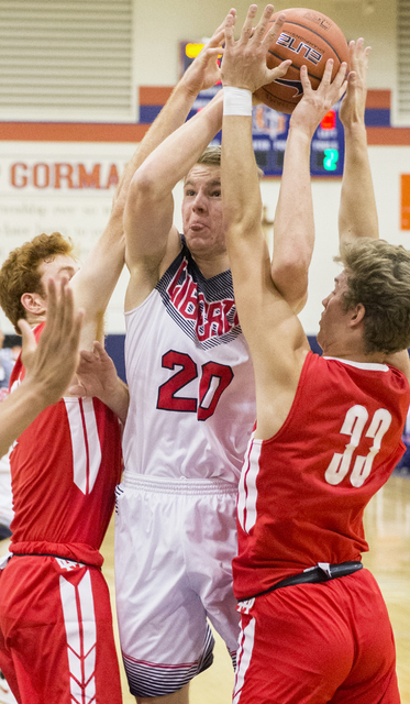 Liberty’s Logan Koch (20) gets tied up with Mater Dei’s Reagan Lundeen (33) duri ...