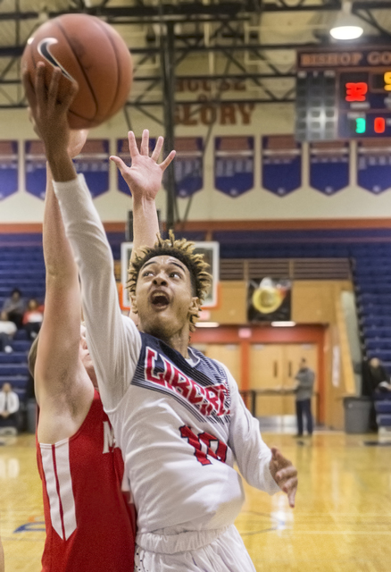 Liberty’s Jordan Holt (10) converts a fast break layup during the Tarkanian Classic o ...