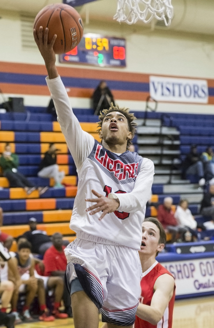 Liberty’s Jordan Holt (10) converts a fast break layup during the Tarkanian Classic o ...
