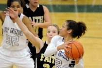 Spring Valley guard Essence Booker (3) goes up for a layup against Faith Lutheran guard Morg ...