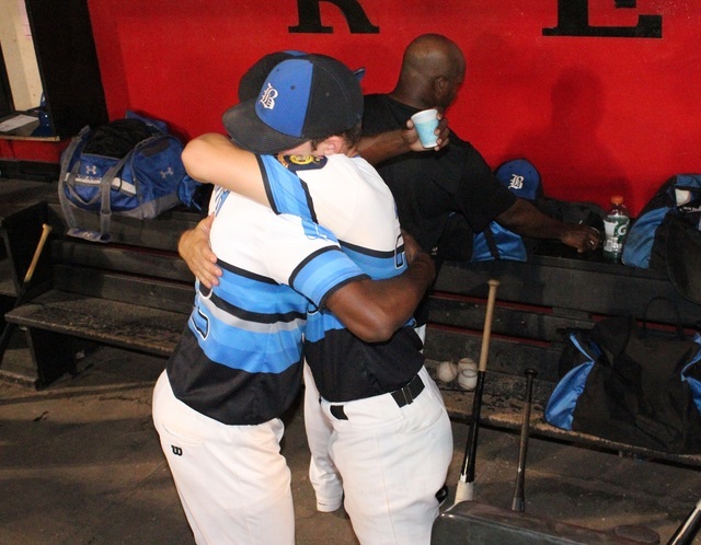 Southern Nevada Blue Sox teammates J.J. Smith and Trent Bixby (r.) embrace prior to Monday n ...