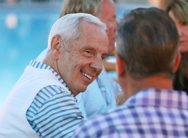 North Carolina coach Roy Williams, left, socializes during the 9th annual Coaches vs. Cancer ...