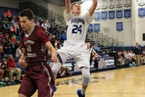 Centennial forward Garett Scheer (24) goes up for a shot past Cimarron-Memorial guard Austin ...