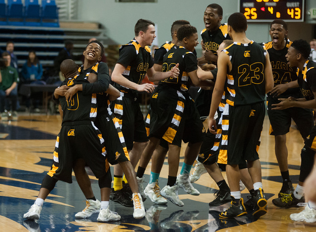 Clark players celebrate after beating Elko 43-25 in the Division I -A state final on Saturda ...