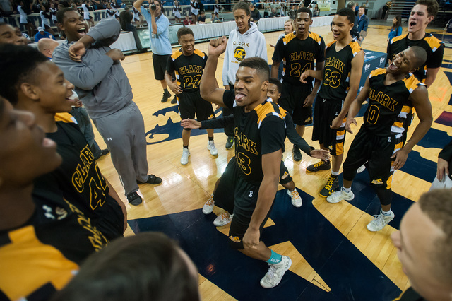 Clark’s Ty’Rek Wells (13) dances with teammates after the Chargers beat Elko 43- ...