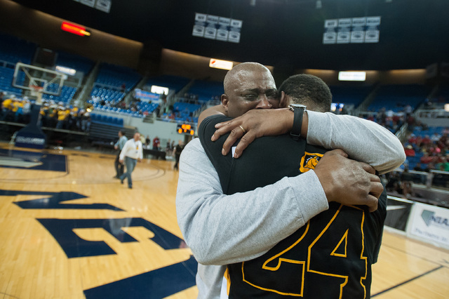David Jones, father of Diontae Jones (24), cries while celebrating with his son after Clark ...