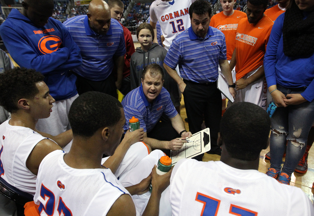 Bishop Gorman coach Grant Rice talks to his team during the Division I championship game aga ...