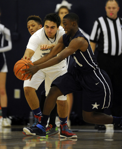 The Meadows School center Alex Agrawal, left, and Agassi Prep guard Cajon Lakes battle for a ...