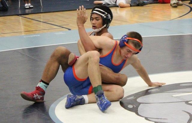 Bishop Gorman’s Liddon Cowden fends off Arbor View’s Destry Talledo in the 145-p ...