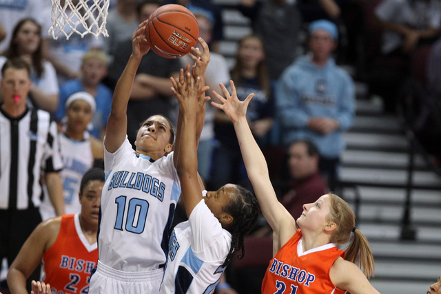 Centennial guard Jayden Eggleston pulls down a rebound against Bishop Gorman during their Di ...