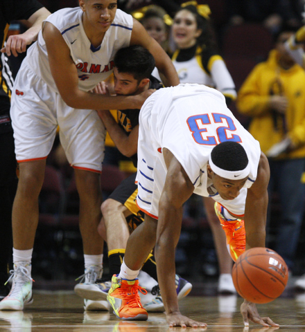 Galena guard Noah Peck is tied up by Bishop Gorman center Chase Jeter as forward Nick Blair ...