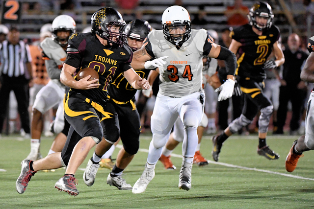 Pahrump Valley’s Peter Murphy carries the ball against Chaparral on Friday, Sept. 16. ...