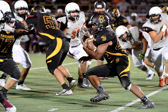 Pahrump Valley’s Aaron Fuentes carries the ball against Chaparral on Friday, Sept. 16. ...