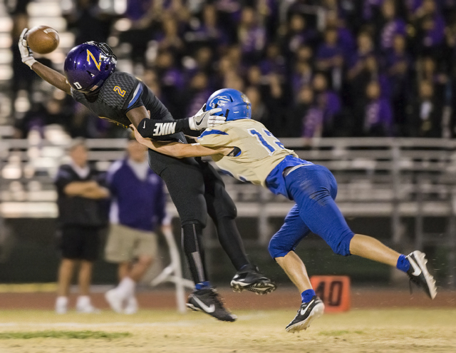 Durango wide receiver Justice Stroy (2) leaps to try and make a reception over Sierra Vista ...
