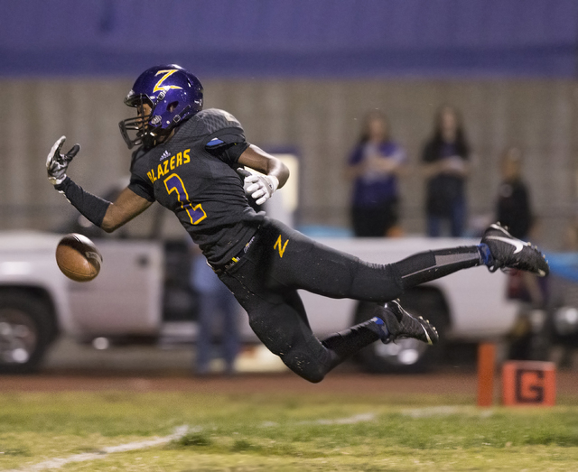 Durango wide receiver Justice Stroy (2) leaps to try and make a diving catch on Friday, Oct. ...