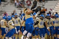 Sierra Vista’s Keki Faatiliga (60) celebrates with teammates after knocking off Durang ...