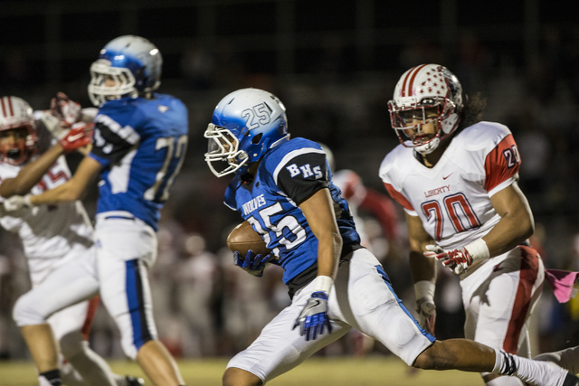 Basic’s Jordan Gallegos (25) returns a kick on Thursday, Oct. 27, 2016, at Basic High ...