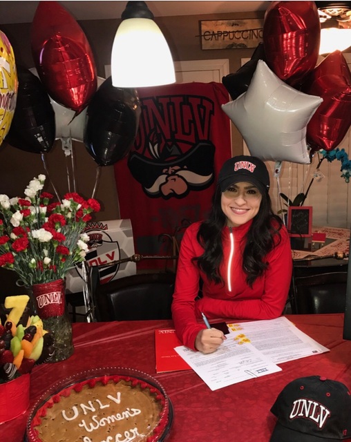 Spring Valley’s Jozee DeCunzo signs her letter of intent to play soccer at UNLV. (Cour ...