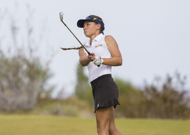 Boulder City golfer Lani Potter hits an iron shot during the Eagles match with Coronado on M ...