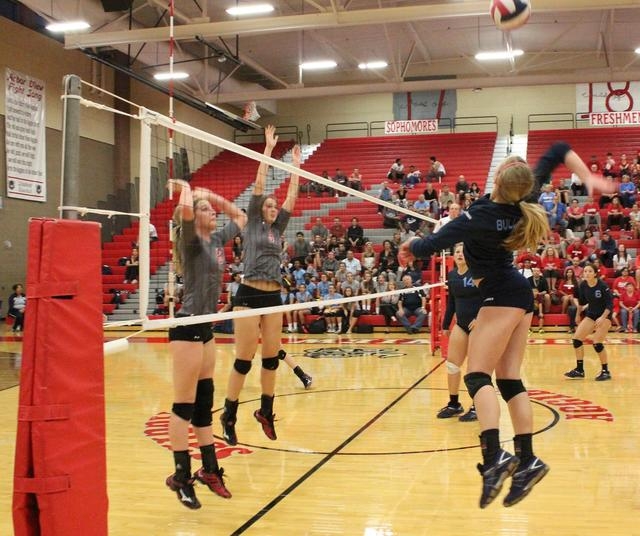 Centennial’s Kjerste Saunders goes for a kill Wednesday night, while Arbor View’ ...