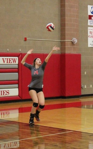 Arbor View’s Trinity Chen serves to Centennial Wednesday night during their Northwest ...