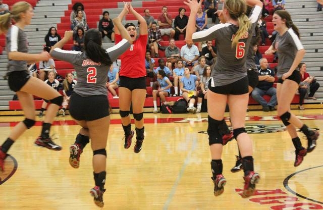 rbor View players celebrate a point Wednesday night against Centennial. The Aggies defeated ...