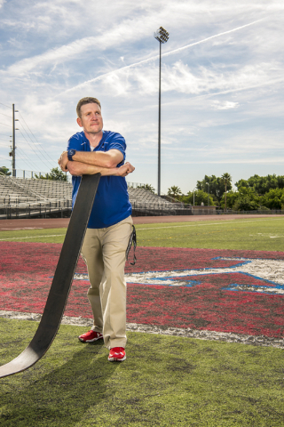 Valley High School football coach George Baker poses for a photo on the football field at Va ...