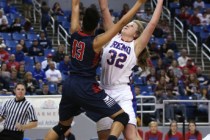 Reno’s Morgan McGwire blocks a shot by Liberty’s Aubre’ Fortner during the ...
