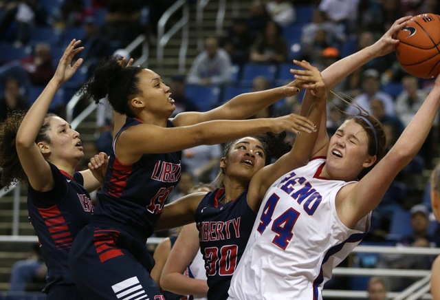 Reno’s Mallory McGwire, right, fights for a rebound during the state championship game ...