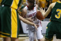 With her hair flying, Liberty’s Kealy Brown drives through a crowd of Bishop Manogue d ...