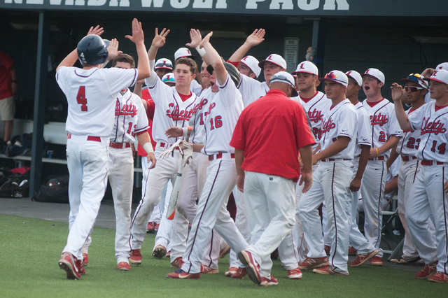 The Liberty bench comes out to greet Jay Martz after scoring the tying run against Centennia ...