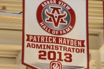 A banner honoring former principal Pat Hayden, at left, hangs in Arbor High School’s A ...