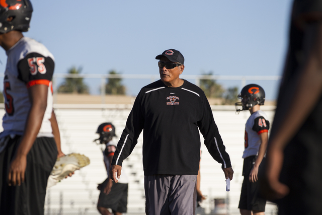 Chaparral head coach Paul Nihipali watches his players stretch during practice on Thursday, ...