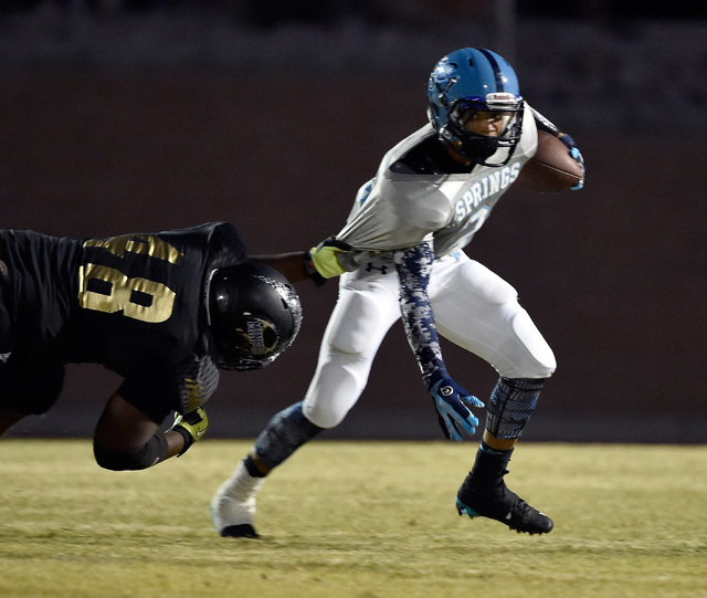 Canyon Springs quarterback Diamante Burton runs with the ball against Sunrise Mountain&#8217 ...