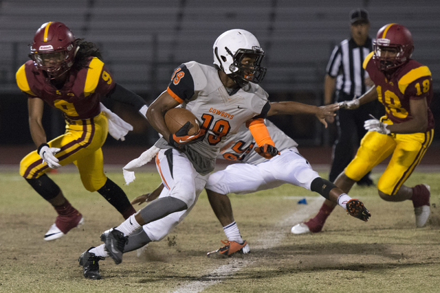 Chaparral’s Tyray Collins (19) runs with the ball during a football game at Del Sol in ...