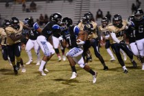 Desert Pines Isaiah Morris (7) runs down field against the Cheyenne defense during their foo ...