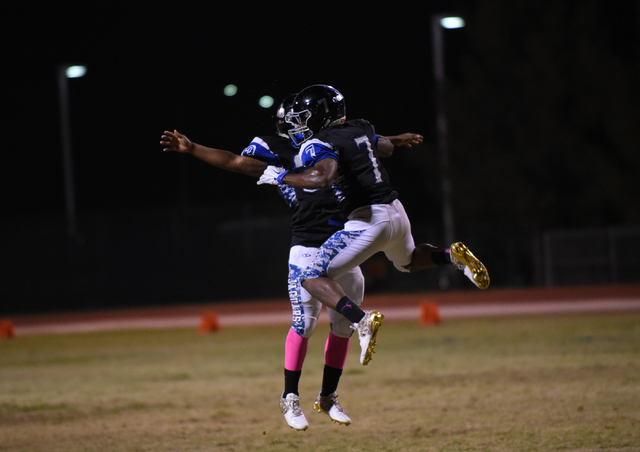 Desert Pines Isaiah Morris (7) celebrates after scoring a touchdown against the Cheyenne def ...