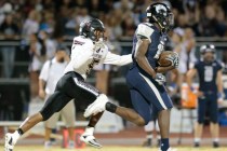 Shadow Ridge senior Malik Lindsey (15) runs the ball down the field as Cimarron-Memorial se ...