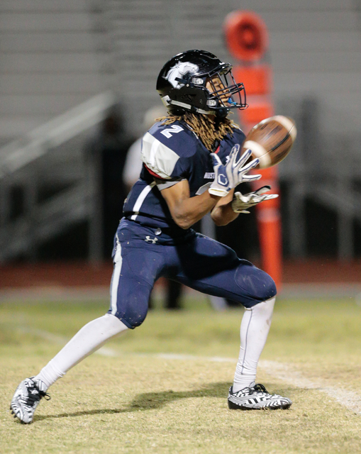 Shadow Ridge junior Elisha Young (2) prepares to catch a kicked ball from Cimarron-Memorial ...