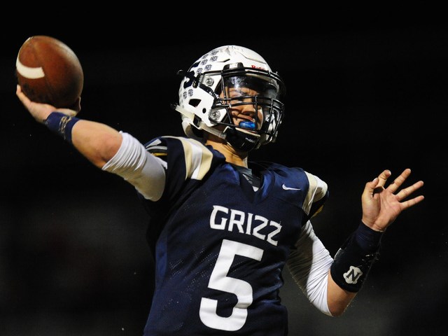 Spring Valley quarterback K.C. Moore passes against Desert Oasis in the first half of their ...