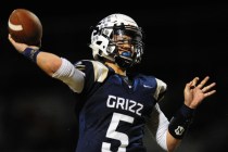Spring Valley quarterback K.C. Moore passes against Desert Oasis in the first half of their ...