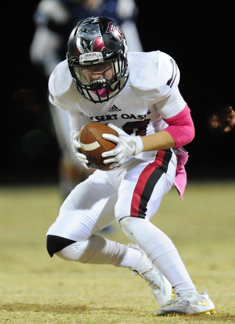 Desert Oasis safety Devin Gomez looks for running room after intercepting a Spring Valley pa ...