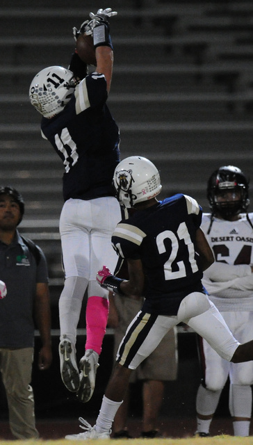 Spring Valley Kash Jenkins catches a pass out of bounds against Desert Oasis in the first ha ...
