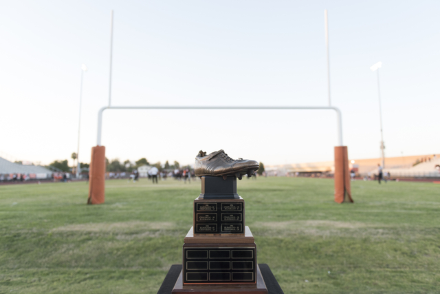 Merlin Olsen’s cleat trophy sits next to the field prior to the Eldorado playing in th ...