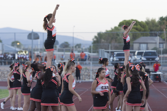 Chaparral cheerleaders warm-up prior to Eldorado playing Chaparral during a football game at ...