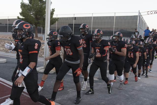 Chaparral football players run onto the field during a game against Eldorado at Chaparral in ...