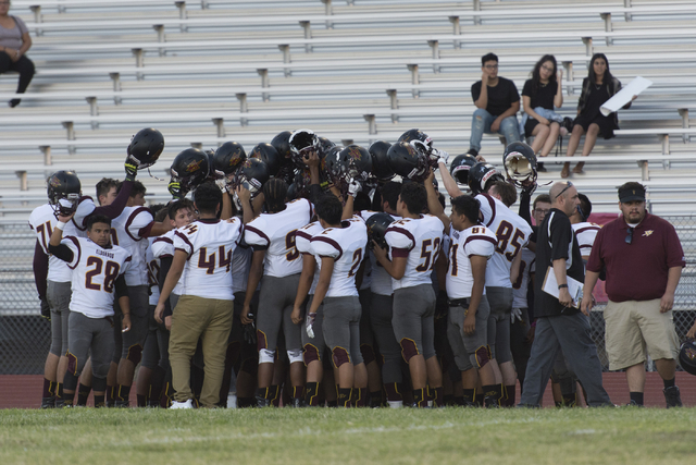 Eldorado football players huddle prior to playing a game at Chaparral in Las Vegas, Friday, ...