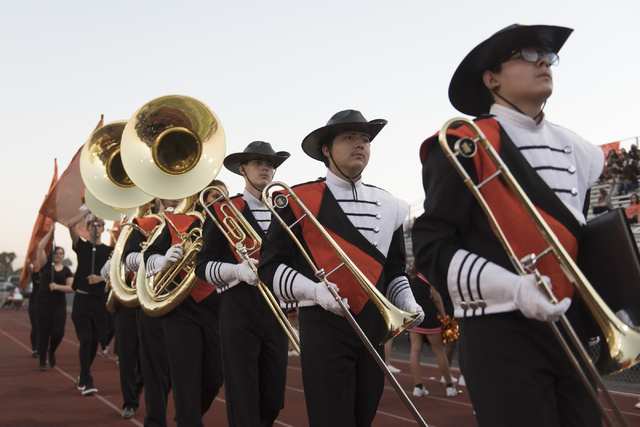 Chaparral marching band members walk on the sideline prior to Eldorado playing a football ga ...