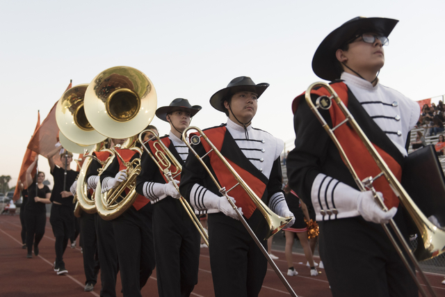 Chaparral marching band members walk on the sideline prior to Eldorado playing a football ga ...